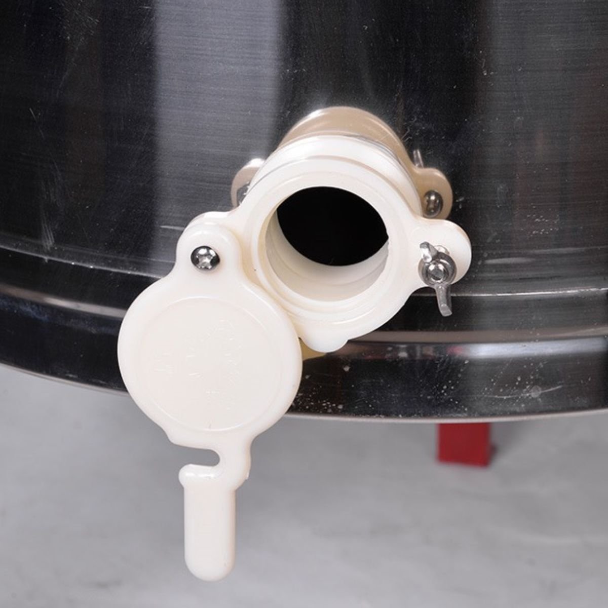 Food-grade honey gate spout on BuzzBeeEquip manual extractor for clean bottling
