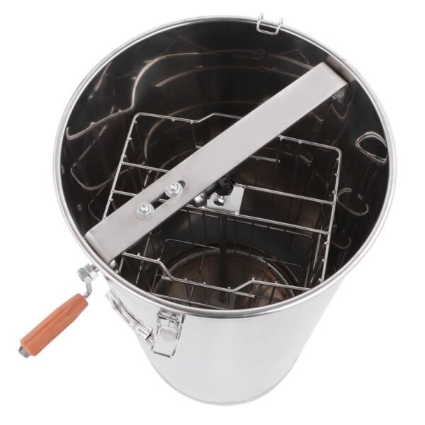 Interior top view of the reinforced two-frame basket inside the stainless honey extractor