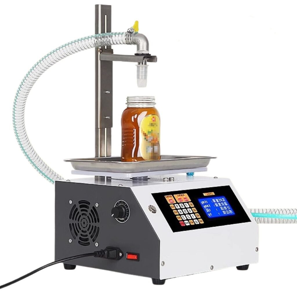 Automatic honey filling machine with load-cell tray and LCD control panel dispensing into a glass jar; ±0.2 g accuracy by BuzzBeeEquip
