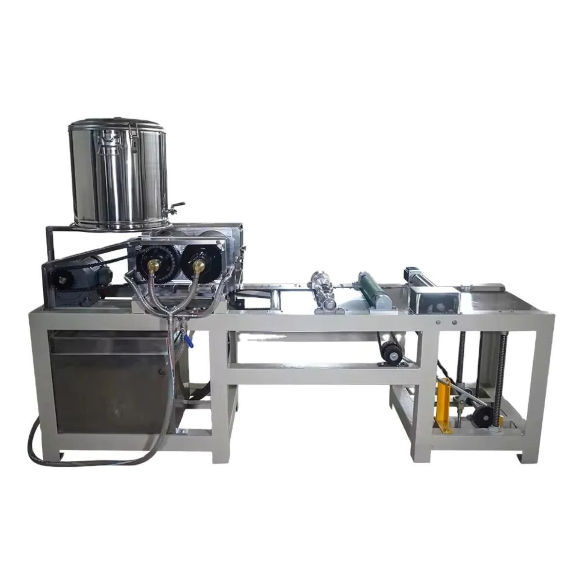 Left side view of BBE-BWF-3 automatic beeswax foundation machine showing wax melting tank, drive motor and sheet transport system as part of an industrial beeswax processing line.